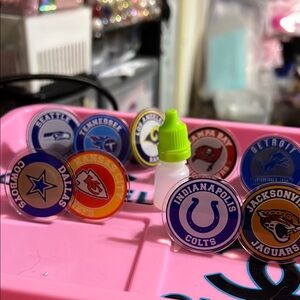 NFL Team Logo Car Vent Air Freshener. Comes with fragrance refill.
